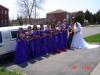 Bride and bridesmaids with the limo