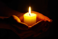 Hands Holding a Candle