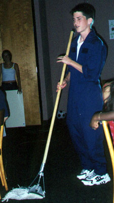 Nick, bka 'Milk,' dances w/a broom
