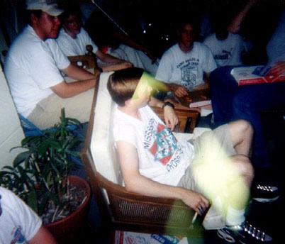Heath sits in a broken chair while chillin' w/the guys