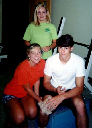 Miranda, Arielle, and Keith in the weightroom