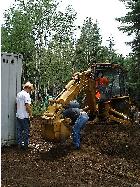 chaining back-hoe to the transportainer