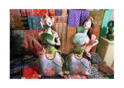 Pile of weaves with ethnic statues