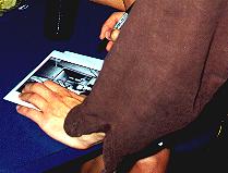 Lang signing the 8x10 glossy