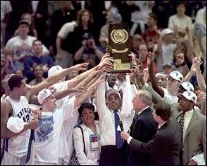 Image: Coach Tubby Smith and the 
Wildcats show off the NCAA 
trophy