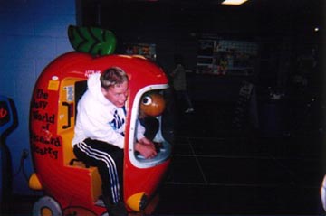 Kevin in a kids apple ride at Wal-Mart!
