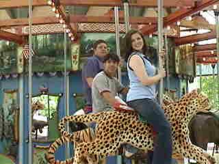 erin, derryk, and jeremy on the carousel.