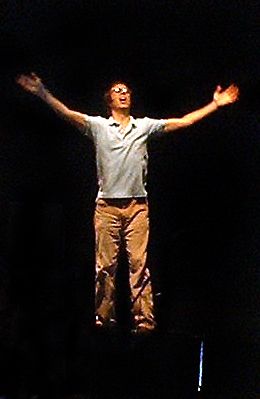 ben on top of his piano conducting the crowd after the song about the dude who climbed a tree on acid at a party and became a bornagain christian
