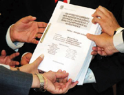 Congress members hold the report successfully laid in Parliament in December 2000.