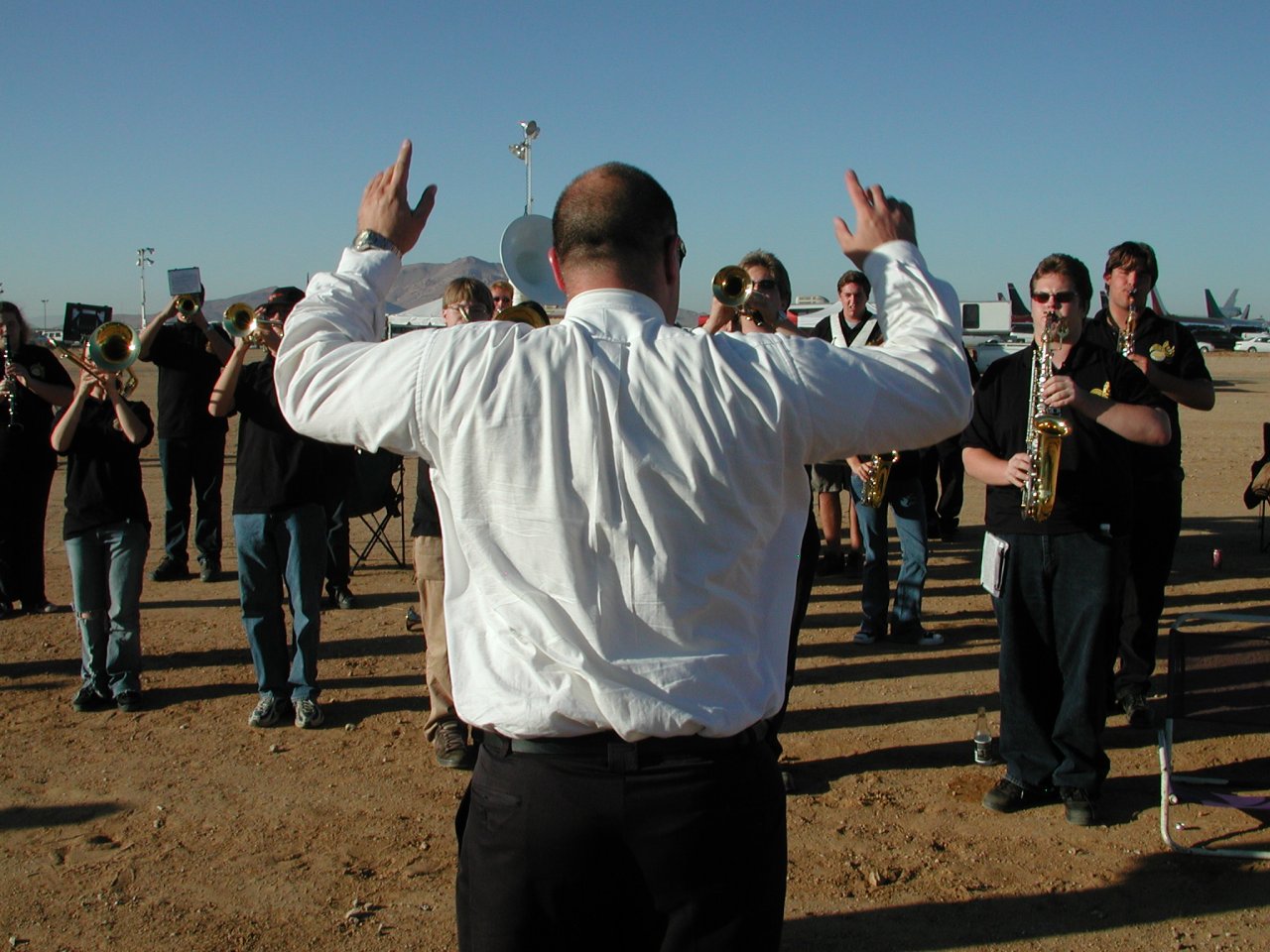 image: the band being forcefully directed