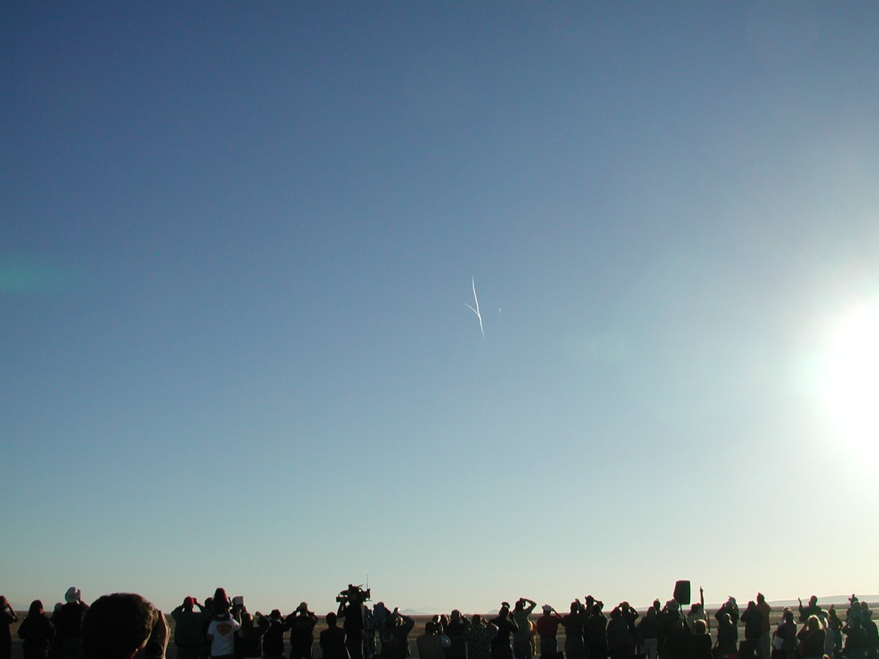 image: the exhaust plume from spaceshipone veers away from that of the mothership