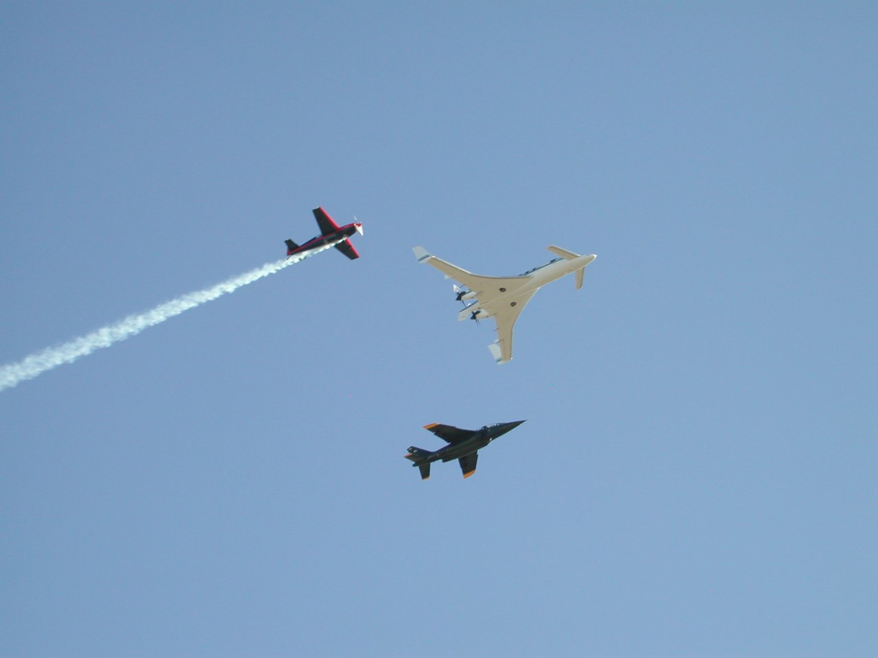 image: three of the chase planes - Starship, a prop and a jet.
