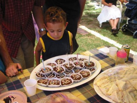 lots of little cakes with the number 5 on them