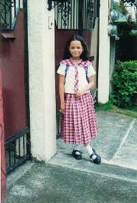 Cherry Ann in front of our gate