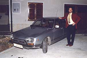 The proud owner shows his really nice car... Load size 116 kbytes.