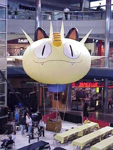 Image-The Meowth Balloon hovers over the Mall of America