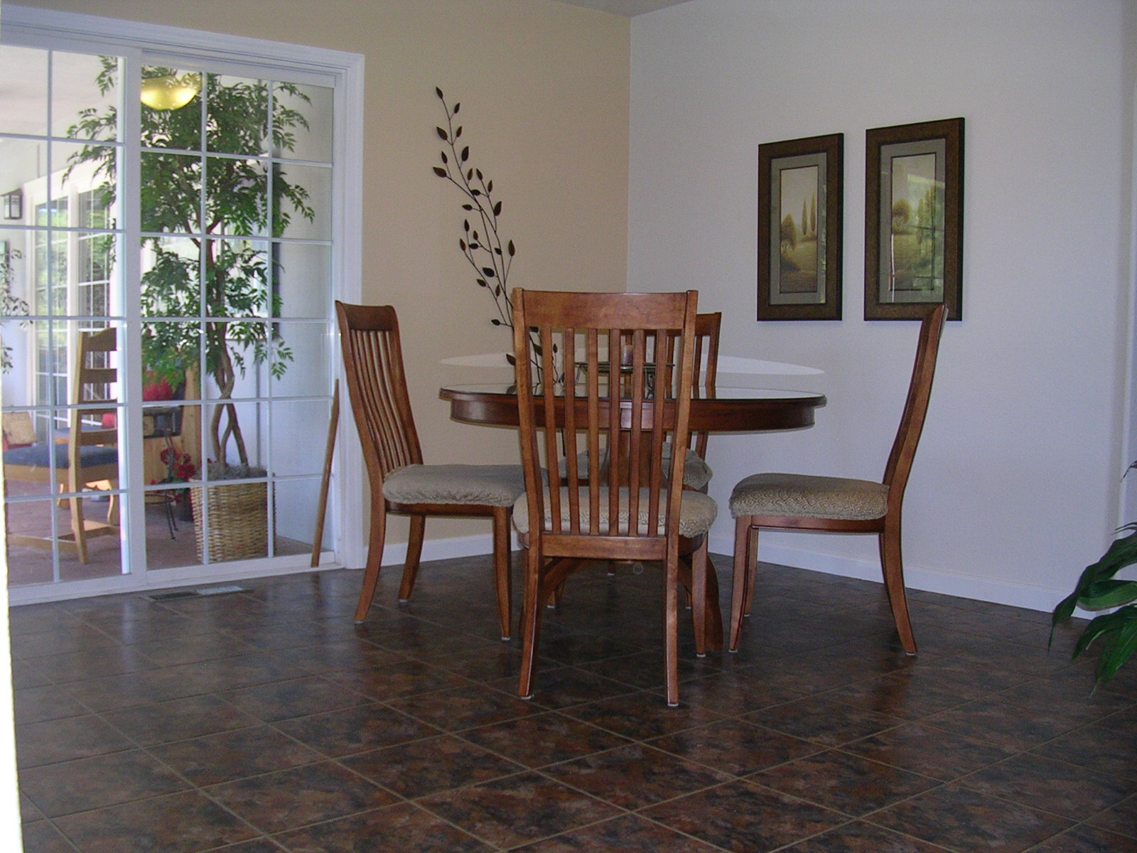 Dining area with slider to screened porch.