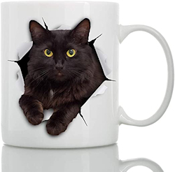 cat breaking through coffee cup