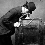 man listening to phonograph