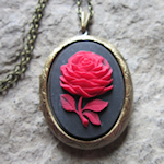 black locket with red rose