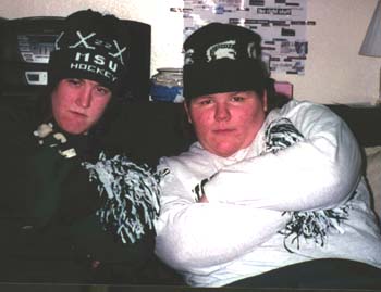 amber and ruth with tough guy faces and lots of michigan state university gear on