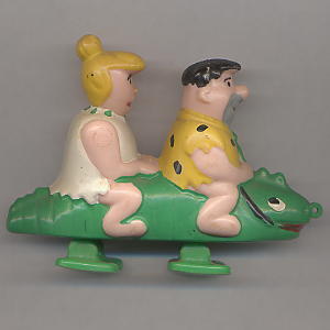 Fred and Wilma Flintstone riding on a crocodile (Marx)