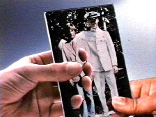 Al shows Sam a photo.Disco Inferno