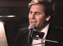Scott sings Somewhere In The Night,accompanying himself on piano.Written by Scott Bakula and Ray Bunch.Ray Bunch wrote all the musical scores for Q.L.Piano Man