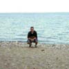 This is a picture of me squating on the beach in the summer of '99.