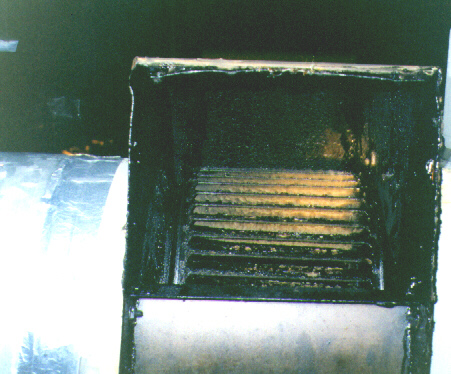 Ontario Restaurant Kitchen Exhaust Rooftop Fan, out of Compliance, full of flammable Grease, Fan not approved for use with Grease.