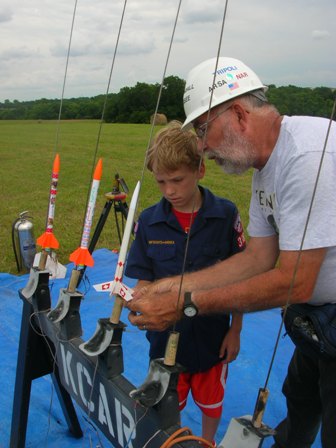 Randall assists at the pads