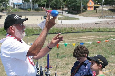 Randall assists at the pads