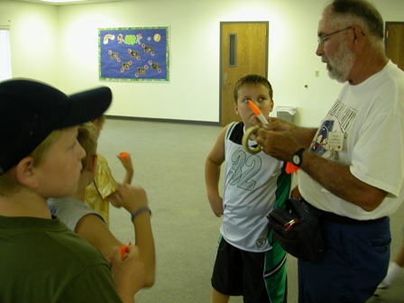 Randall assists with some last minute touching up