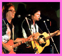 Denny Laine and Scott Moss performing together on stage at wings of love concert