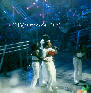 Howie shows off the true shape of his heart thanks to a fan's prop and the dancers.