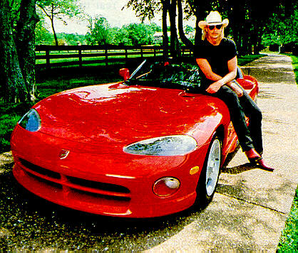 Alan beside red car