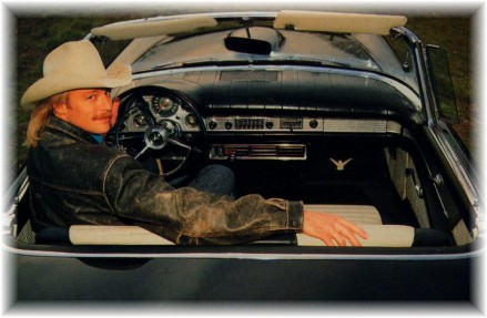 Alan in his car looking back