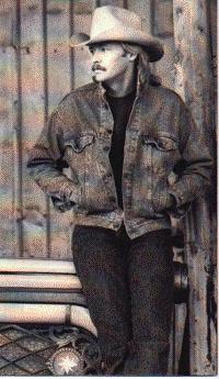Black and white of Alan Jackson leaning on jukebox