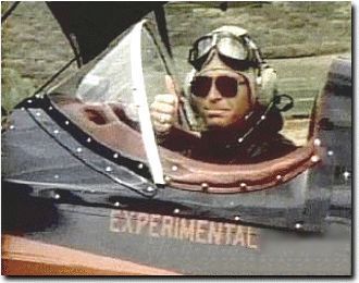 John Denver in his bi-plane