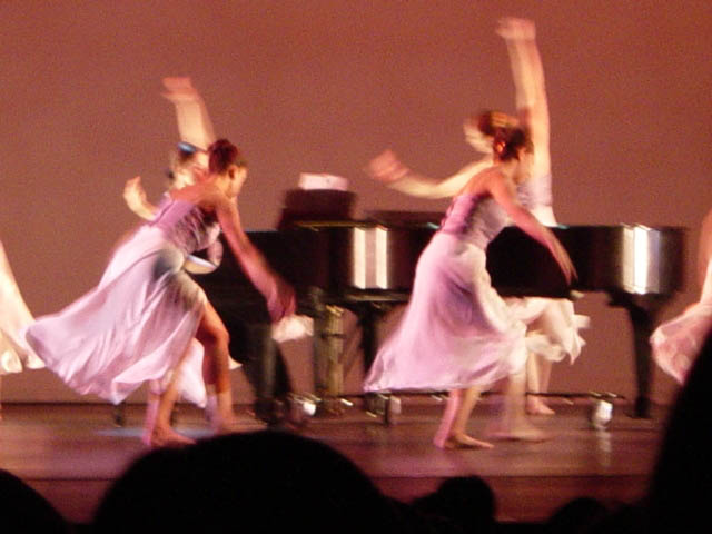 Dancers Leaping Around Piano