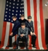 Beatles in front of the Flag