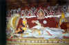 Mahavishnu in lying position, escorted by consorts. Decorated with rich murals, in the background and roof