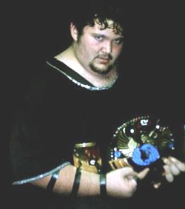 Corey poses with his new belt shortly after winning the ACWA Championship at the Klick