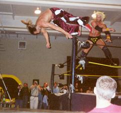 Pain gets dumped off the top rope by Steve Corino at the OMEGA Reunion show last December -- photo credit to www.cham-pain.com