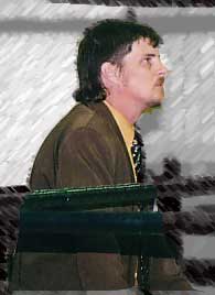 The Pastor looks on intently.