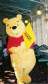 Winnie-the-Pooh parading around dining room.