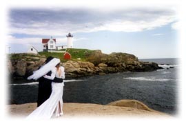 bride and groom walking the 
beach
