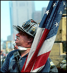 fireman holding US Flag