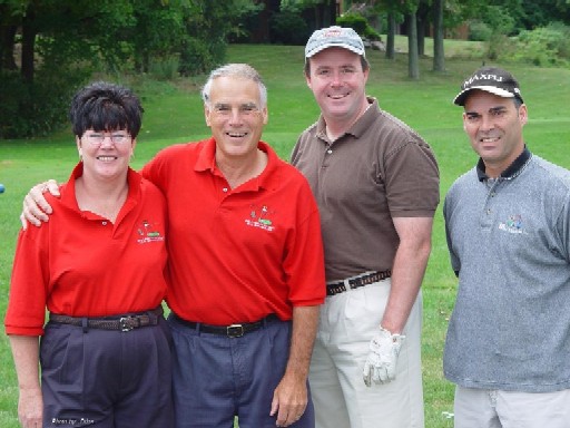 Buffy & John with Patrick & Fred at the Octoberfest Golf Scramble