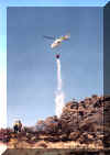 Helicopter 85-Alpha doing bucket work on the Mud Springs fire near Midas, NV in July 2001.